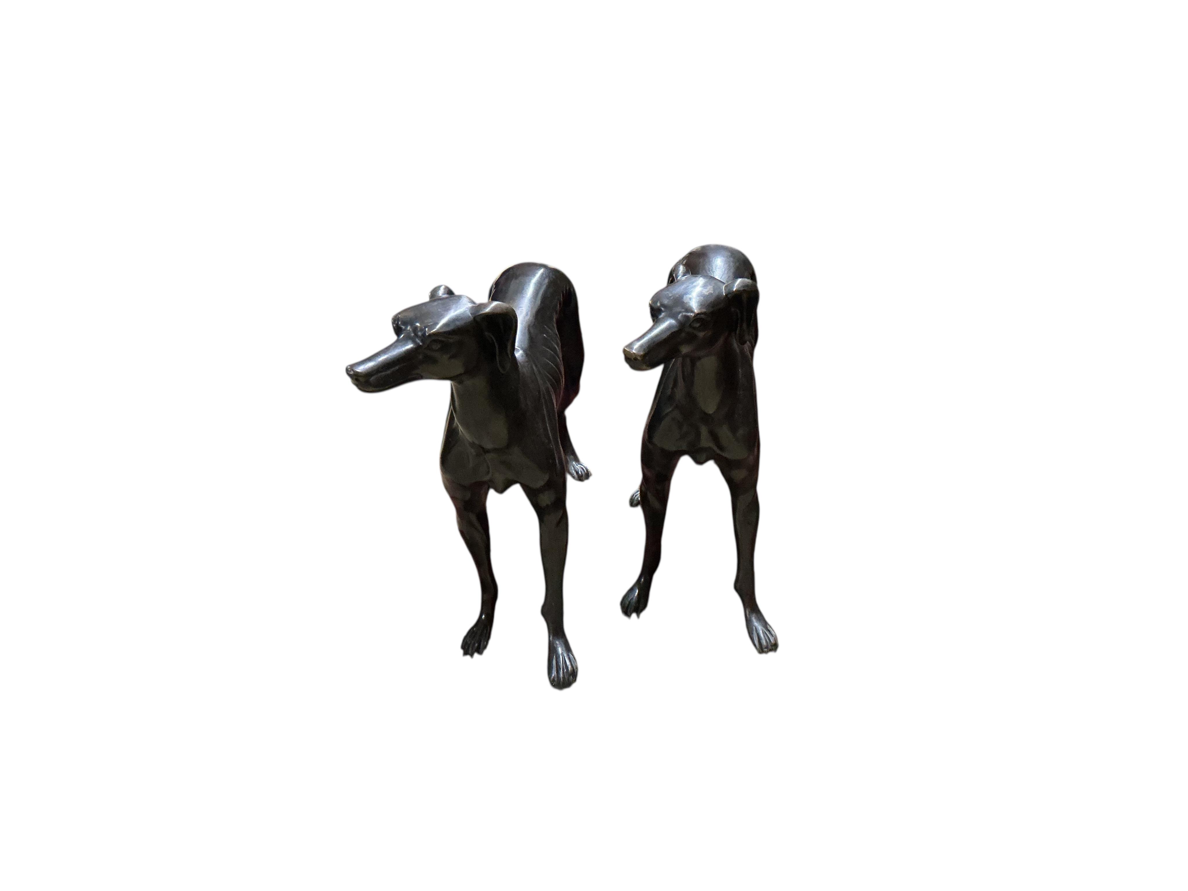 A pair of modern bronze models of greyhounds, length 70cm, height 51cm